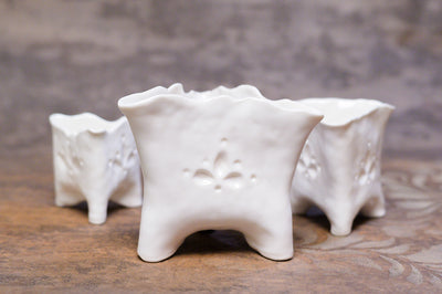 Porcelain Luminaries [triangular candle holders]